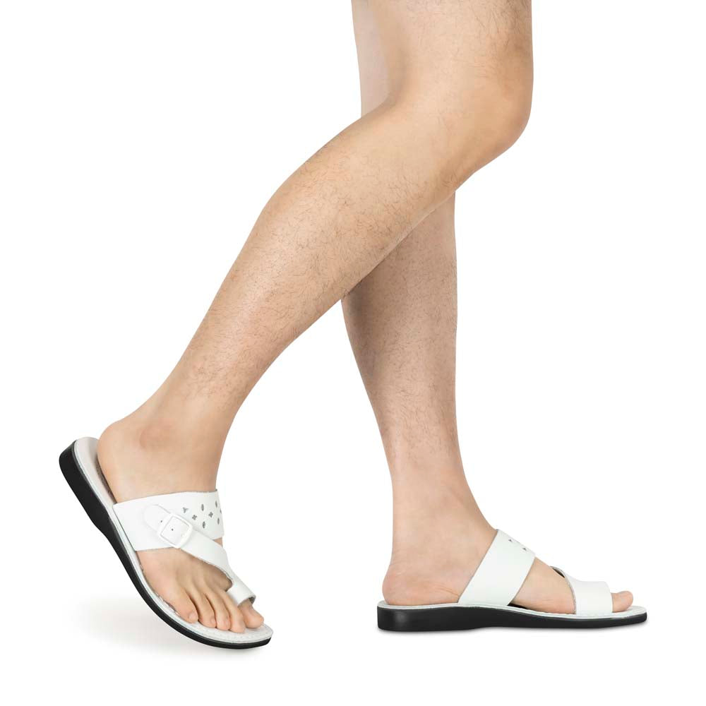 Model wearing Ezra white, handmade leather slide sandals with toe loop