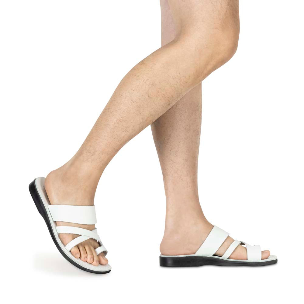 Model wearing The Good Shepherd white, handmade leather slide sandals with toe loop - Side View