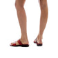 Model wearing Aviv red, handmade leather slide sandals 