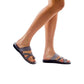 Model wearing The Good Shepherd gray, handmade leather slide sandals with toe loop