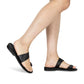 Model wearing Abra black, handmade leather slide sandals with toe loop