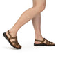 Model wearing Michael Oiled Brown closed toe leather sandal - side view