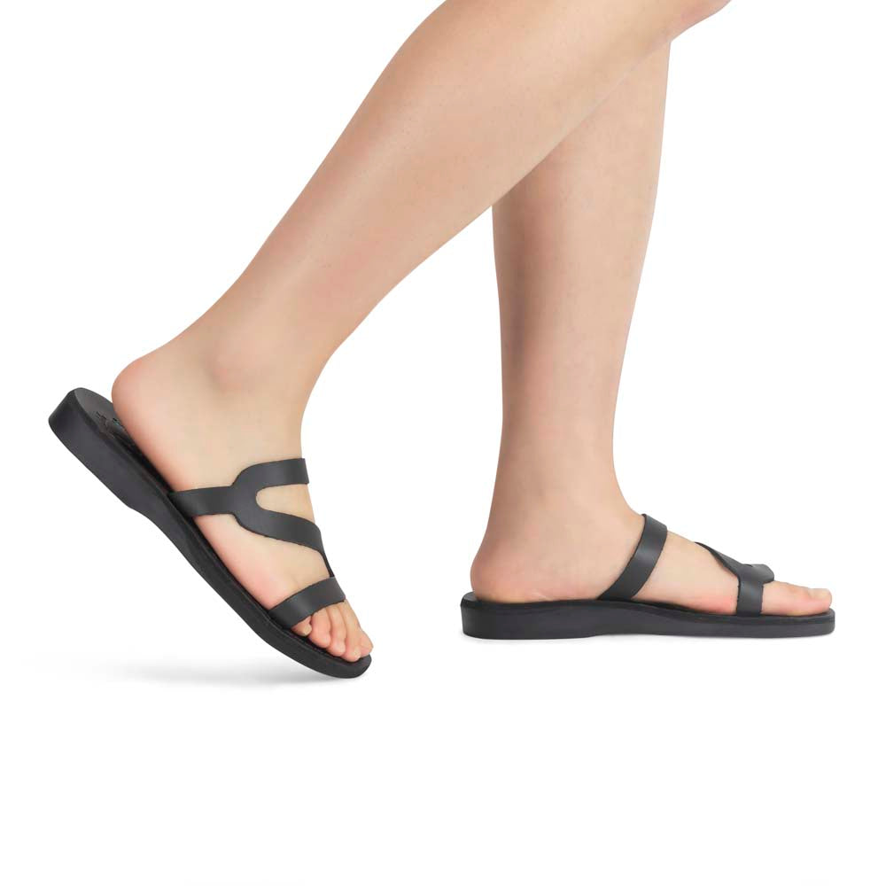 Model wearing Natalie black, handmade leather slide sandals with open toe