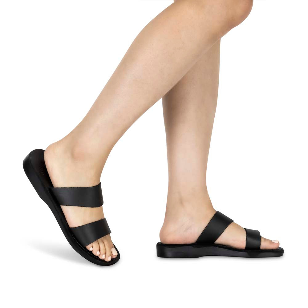 Model wearing Aviv black, handmade leather slide sandals
