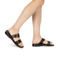 Model wearing Aviv brown, handmade leather slide sandals