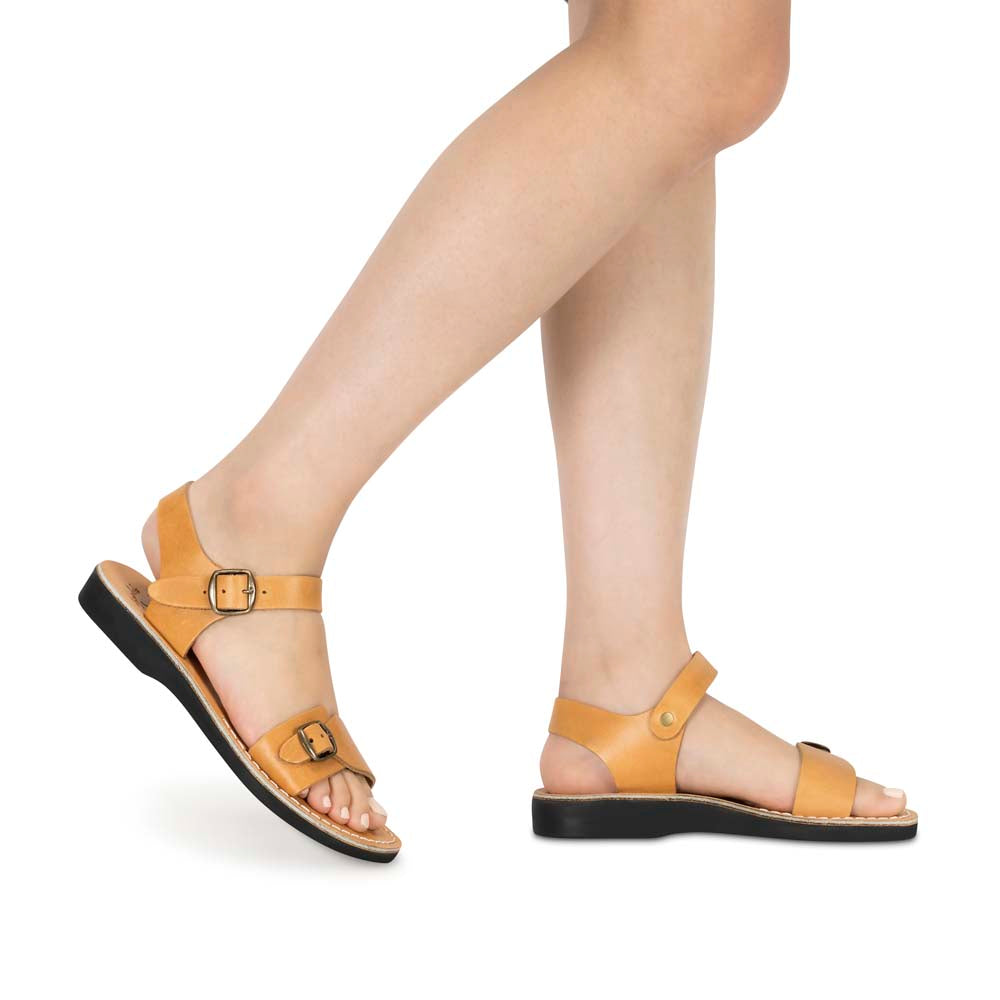 Model wearing The Original tan, handmade leather sandals with back strap