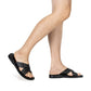 Model wearing Jesse black, handmade leather slide sandals - Front View