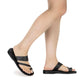 Model wearing Zohar black, handmade leather slide sandals with toe loop