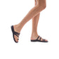 Model wearing Nora brown, handmade leather slide sandals with toe loop