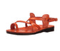 The Good Shepherd Buckle orange, handmade leather sandals with back strap and toe loop- left View