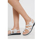 The Good Shepherd Buckle white, handmade leather sandals with back strap and toe loop- on model View