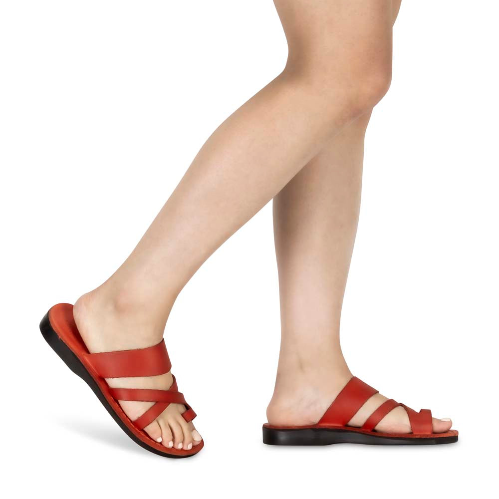 Model wearing The Good Shepherd red, handmade leather slide sandals with toe loop