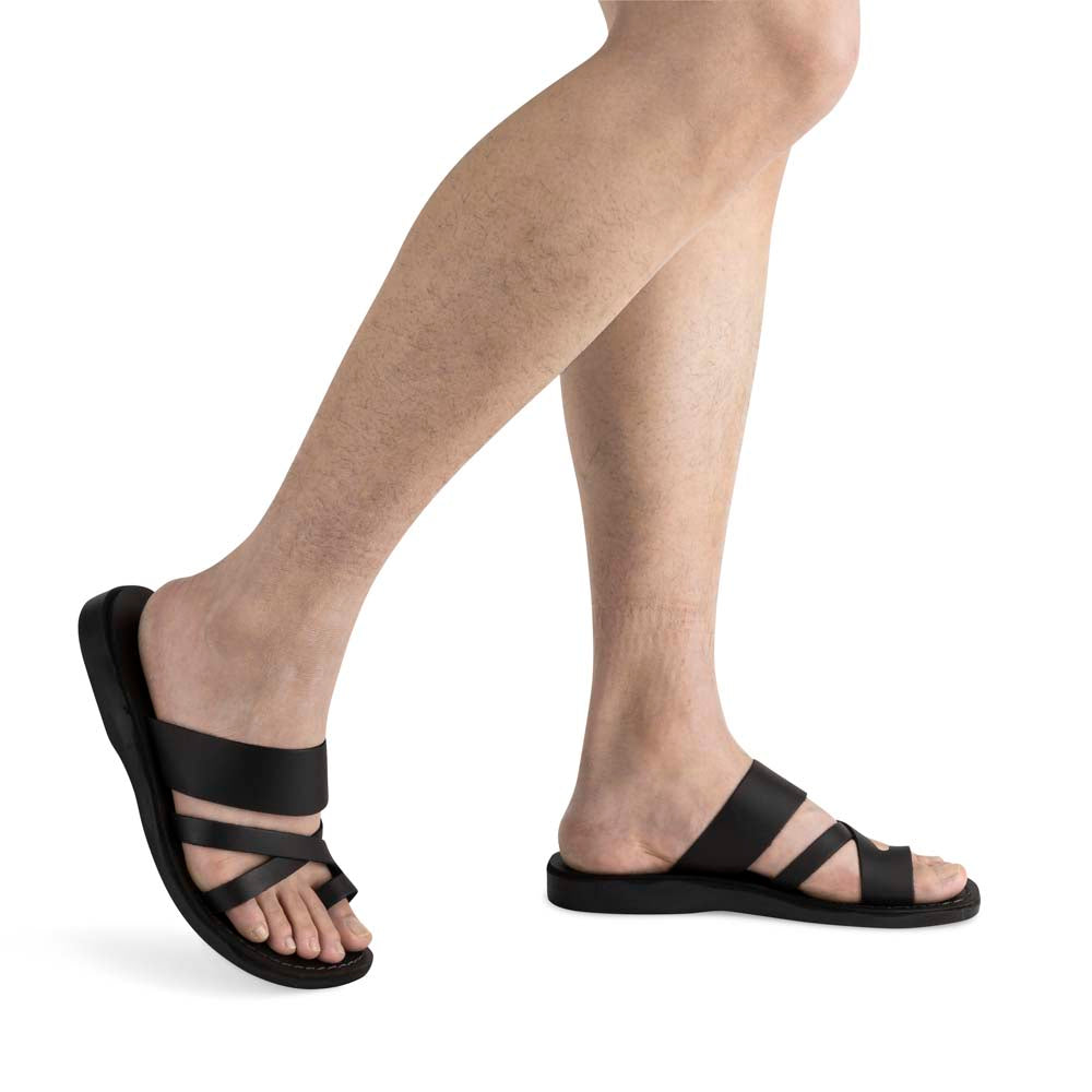 Male Model wearing The Good Shepherd black, handmade leather slide sandals with toe loop