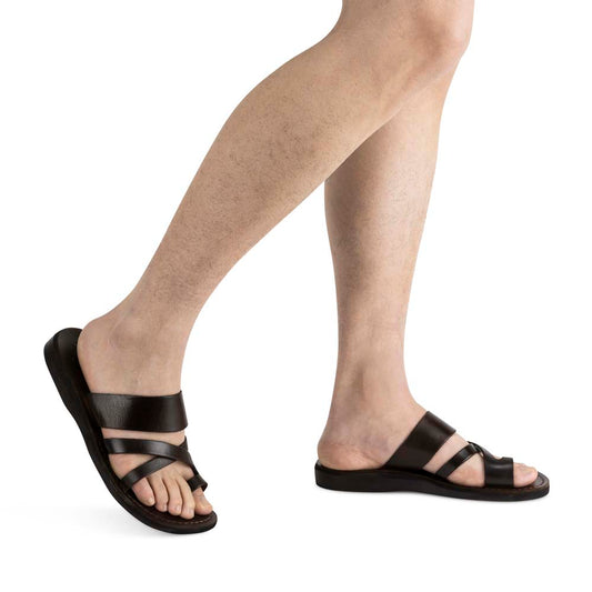 Model wearing The Good Shepherd brown, handmade leather slide sandals with toe loop