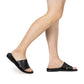 Model wearing Bashan black, handmade leather slide sandals