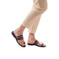 Model wearing Angela brown, handmade leather slide sandals with toe loop 