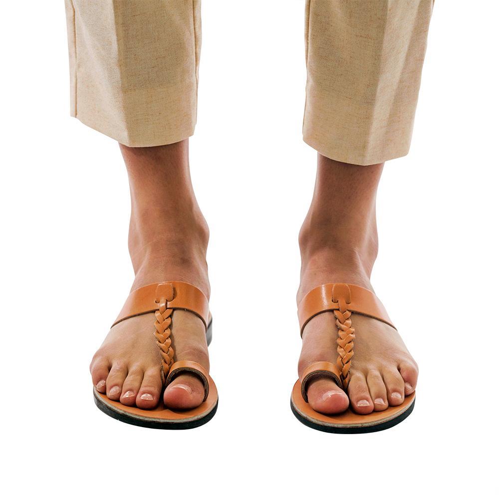 Model wearing Ara tan, handmade leather slide sandals with toe loop 