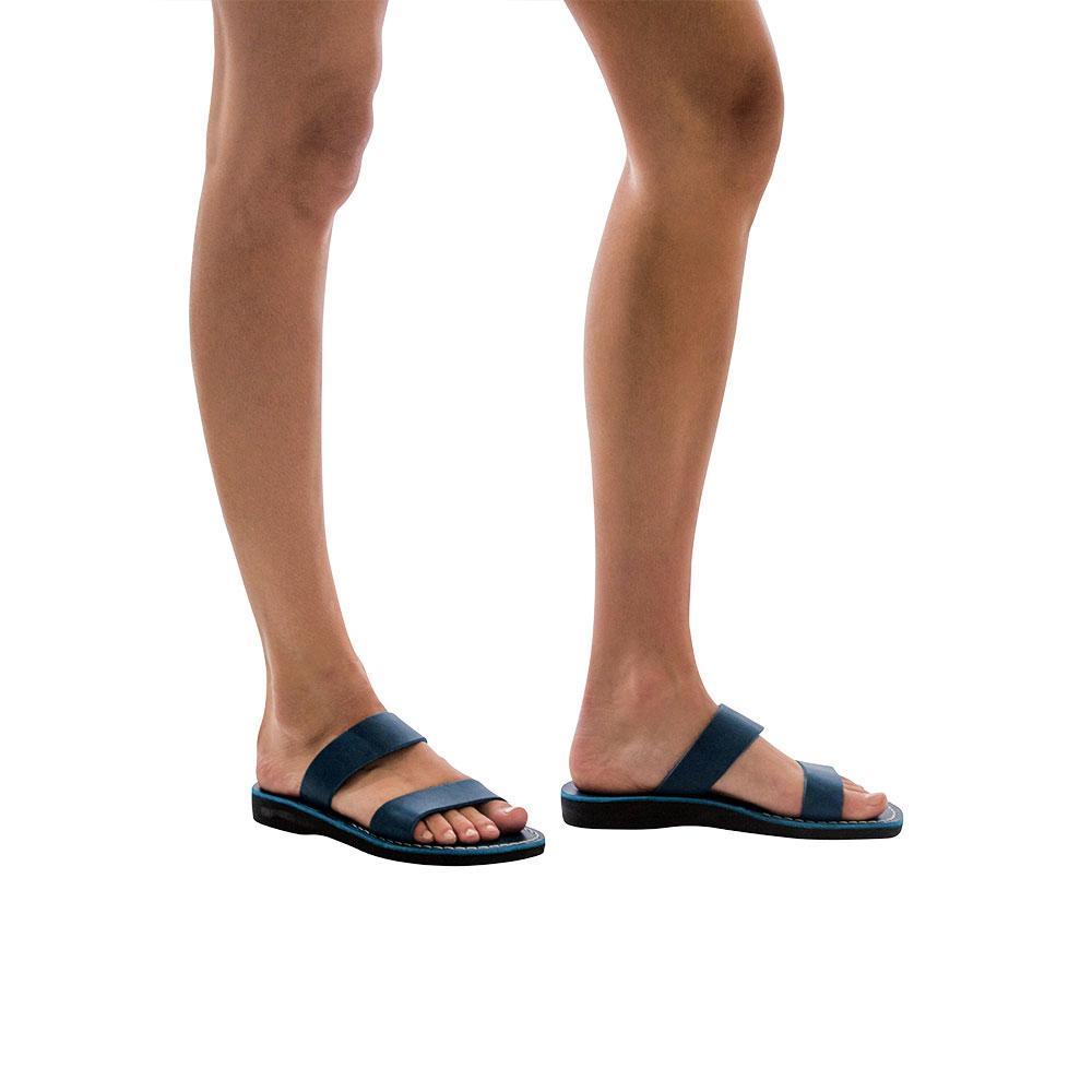 Model wearing Aviv blue, handmade leather slide sandals 
