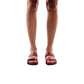 Model wearing Aviv red, handmade leather slide sandals 
