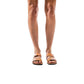 Model wearing Aviv tan, handmade leather slide sandals 