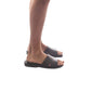 Model wearing Bashan brown, handmade leather slide sandals 
