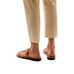 Model wearing David tan, handmade leather slide sandals with toe loop 