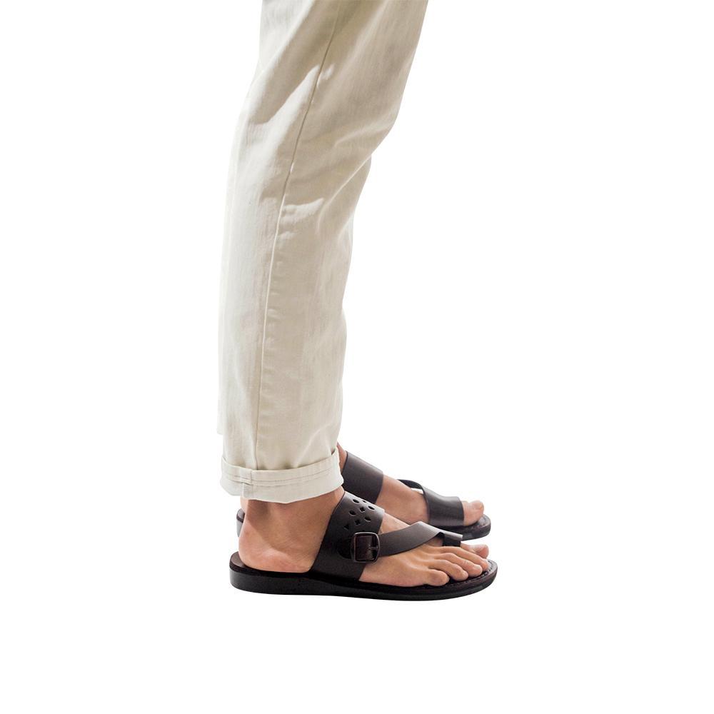 Model wearing Ezra Brown, handmade leather slide sandals with toe loop