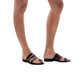 Model wearing Layla brown, handmade leather slide sandals with toe loop