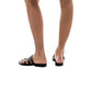 Model wearing Layla brown, handmade leather slide sandals with toe loop