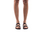Model wearing Rachel Brown , handmade leather slide sandals with toe loop