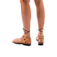Model wearing Ramah Tan, handmade leather sandals with back strap and toe loop