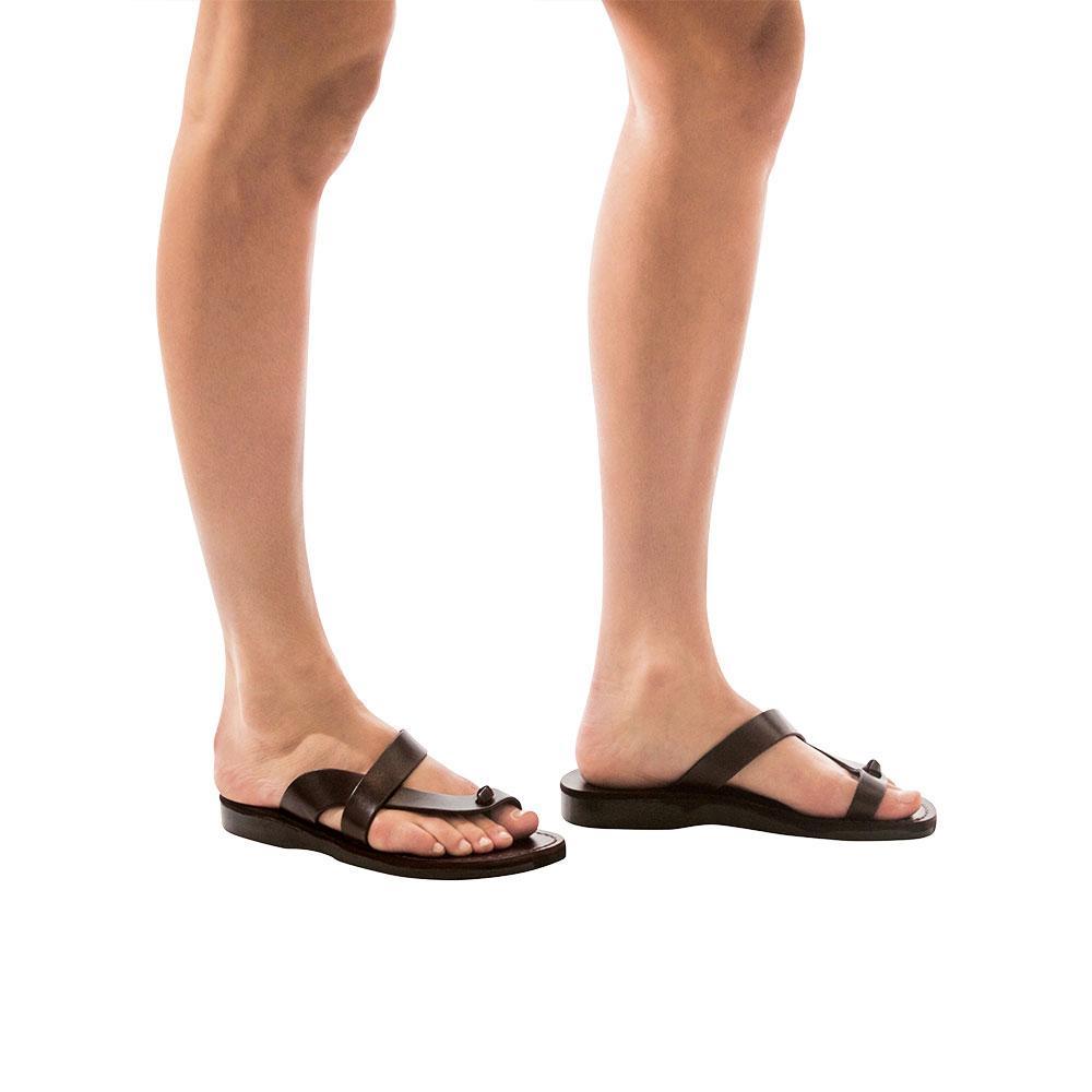 Model wearing Tal Brown, handmade leather slide sandals with toe loop