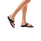 Model wearing Tal Brown, handmade leather slide sandals with toe loop