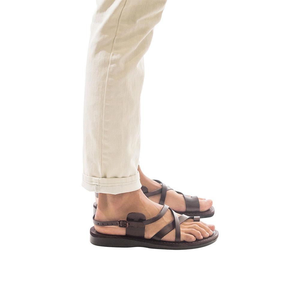 Model wearing The Good Shepherd Buckle brown, handmade leather sandals with back strap and toe loop