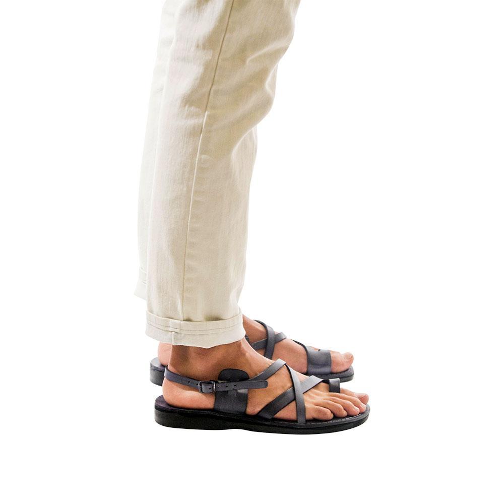 Model wearing The Good Shepherd Buckle gray, handmade leather sandals with back strap and toe loop