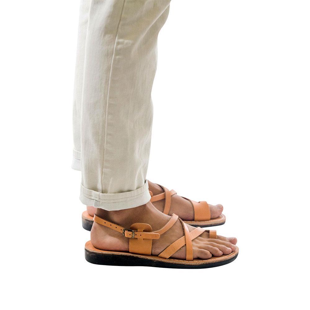 Model wearing The Good Shepherd Buckle tan, handmade leather sandals with back strap and toe loop