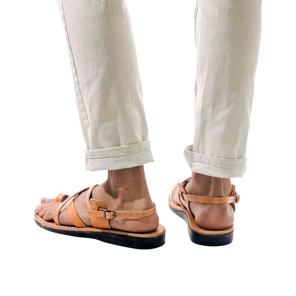 Model wearing The Good Shepherd Buckle tan, handmade leather sandals with back strap and toe loop