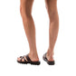 Model wearing The Good Shepherd Molded brown, handmade leather slide sandals with toe loop