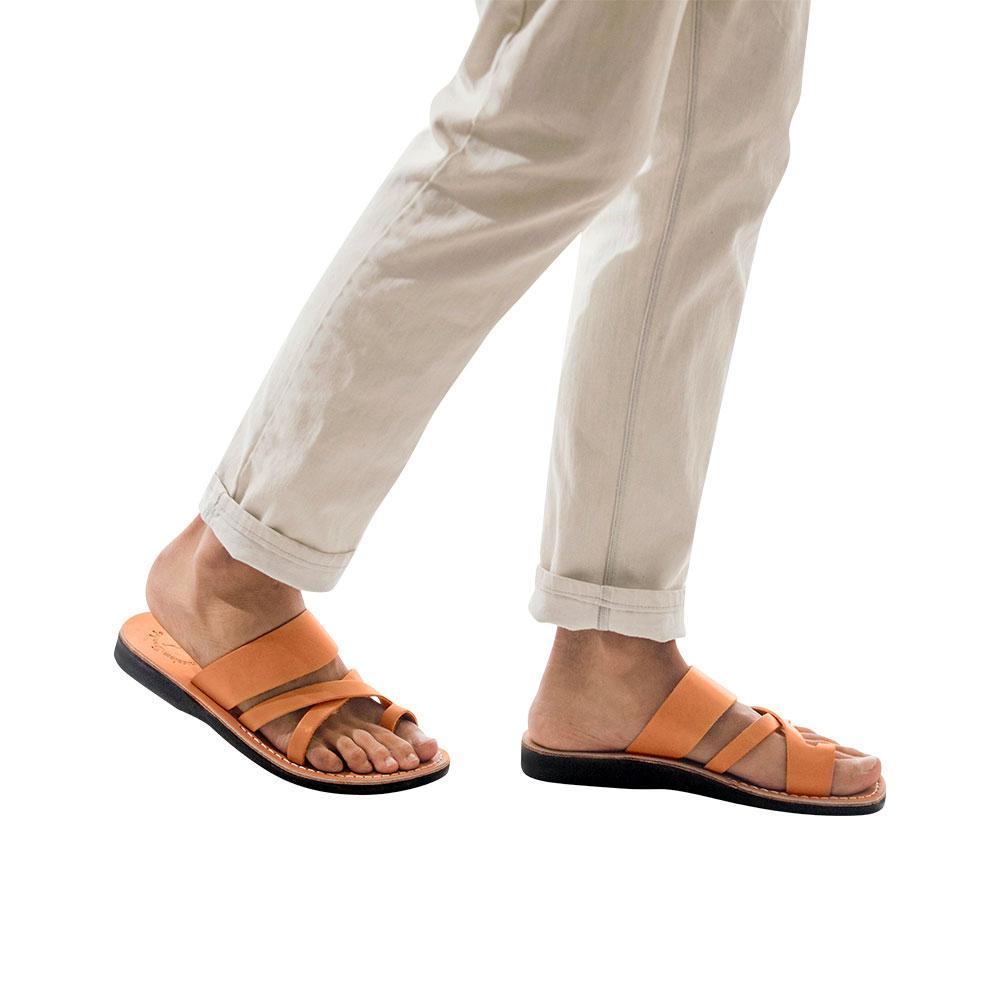 Model wearing The Good Shepherd tan, handmade leather slide sandals with toe loop