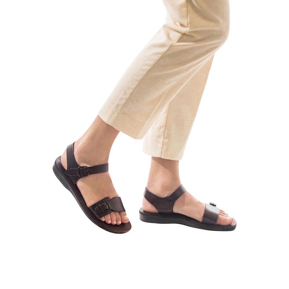 Model wearing The Original brown, handmade leather sandals with back strap 