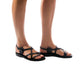 Model wearing Tzippora black, handmade leather sandals with back strap