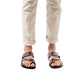 Model wearing Zohar brown, handmade leather slide sandals with toe loop