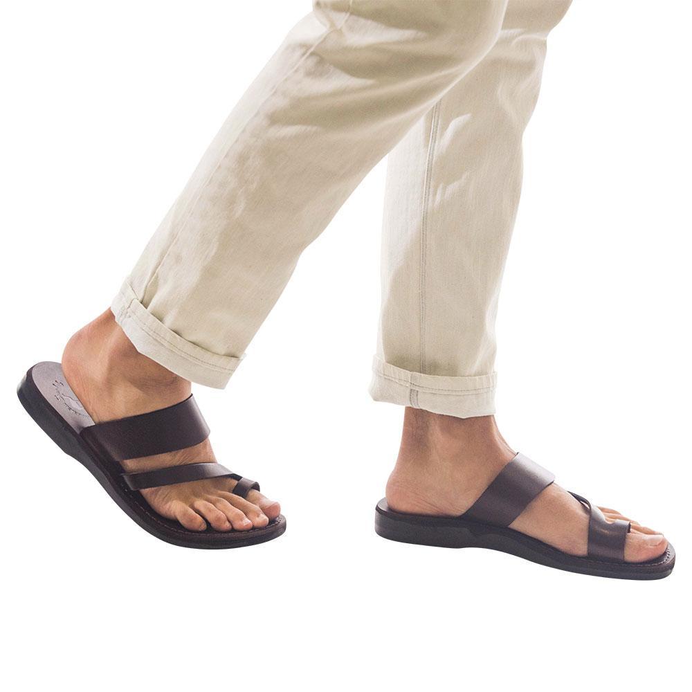 Model wearing Zohar brown, handmade leather slide sandals with toe loop