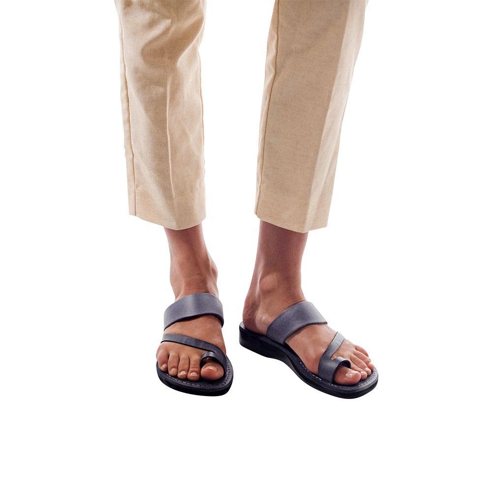 Model wearing Zohar gray, handmade leather slide sandals with toe loop